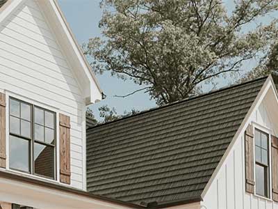Close up of a residential roof with brown with a slight touch of green Vicwest metal roof tiles